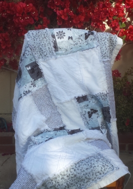 Rag quilt in white and teal.