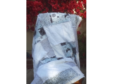 Rag quilt in white and teal.